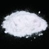 Close-up image of fine ketamine powder in a container, showcasing its smooth texture and high purity.