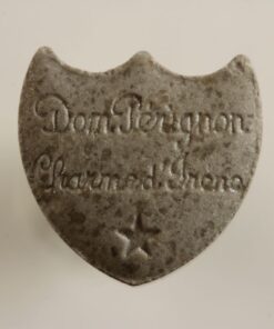 Close-up image of Dom Perignon MDMA pills with a champagne logo imprint, showcasing their premium quality and vibrant colors.