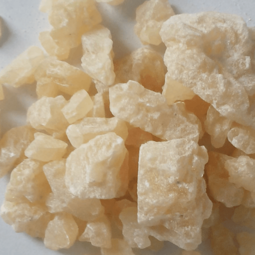 Close-up image of high-quality Crystal MDMA, showcasing its pure, crystalline form.