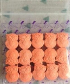 Close-up image of Owl MDMA pills with a distinctive owl imprint, showcasing their vibrant colors and premium quality.